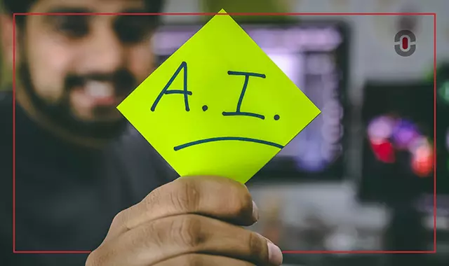 A person holding a bright green sticky note with "A.I." and a sad face drawn on it, representing concerns or skepticism about artificial intelligence, possibly in the context of AI translation challenges.