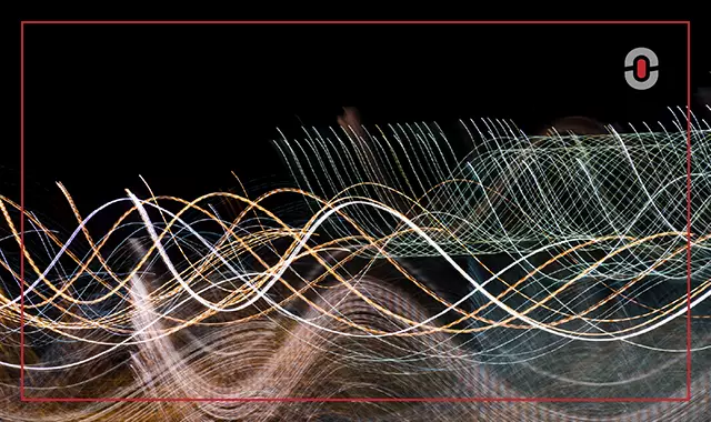 Abstract visual of colorful light trails symbolizing data flow and complexity in machine translation, with the 1-StopAsia logo in the top-right corner.