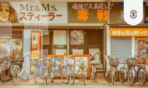 Street scene in Japan with movie posters and multilingual signage. Highlights the complexity of cultural and linguistic nuance in global media localization.