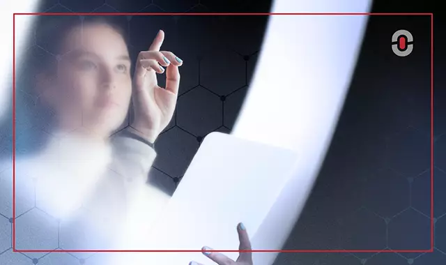 Futuristic image of a woman using a tablet and touching a digital interface, symbolizing human interaction with advanced AI translation systems.