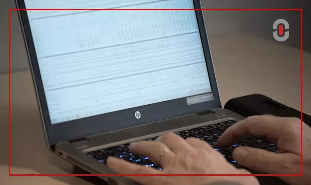 Financial regulatory documents being reviewed for bilingual compliance